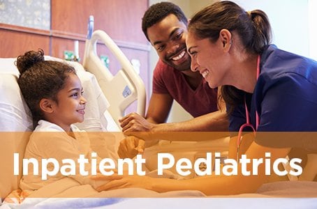 Inpatient Pediatrics link - Image: Nurse talks to child in hospital bed, dad stands beside child's bed