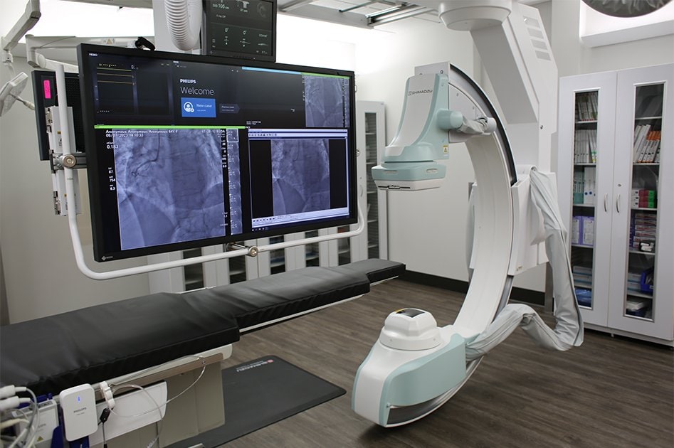 Cardiac catheterization room with table and equipment